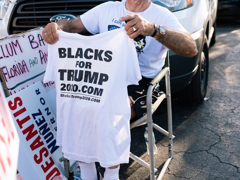 FORT LAUDERDALE, FLORIDA, UNITED STATES - 2018/11/10: A protester seen holding a t-shirt 'Blacks for...