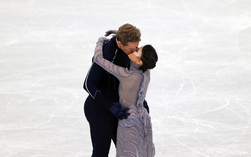 Madison Chock and Evan Bates kiss at the 2022 Winter Olympics