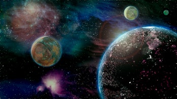 Computer illustration of an extrasolar planet with three moons and gaseous nebula.