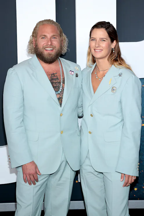 Jonah Hill and Sarah Brady wear matching blue Gucci suits.
