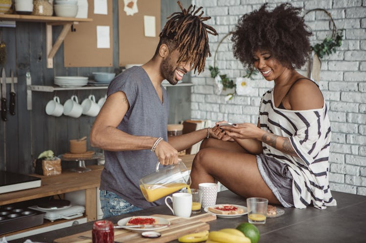 Young couple looking for at home valentines day ideas to stay at home.