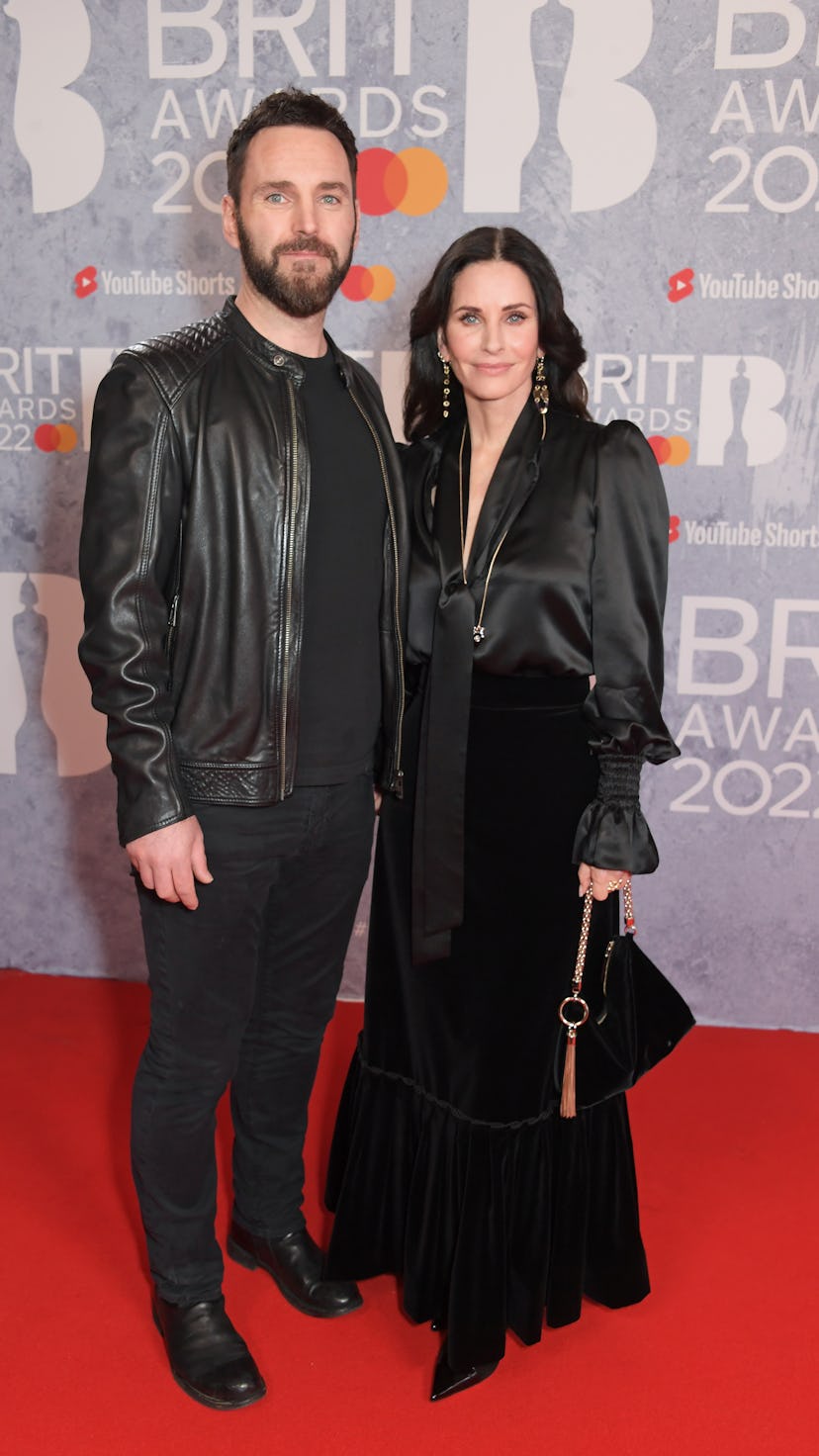Johnny McDaid and Courteney Cox in all black at the Brit Awards 
