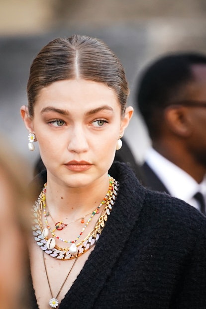 Gigi Hadid wearing layered necklaces in Paris in 2019. 