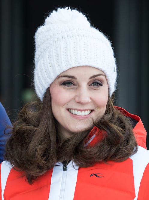 The Duchess of Cambridge in a white beanie and red jacket while skiing in Oslo.