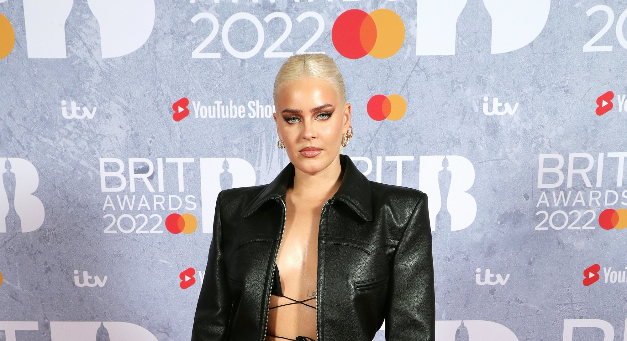 Anne-Marie in a leather jacket and lace up top at the Brit Awards in London.