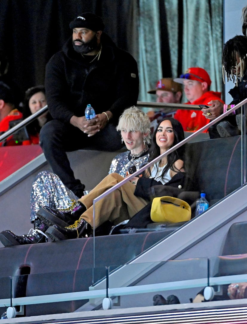 LAS VEGAS, NEVADA - FEBRUARY 05: (L-R) Machine Gun Kelly and Megan Fox are seen in the stands after ...