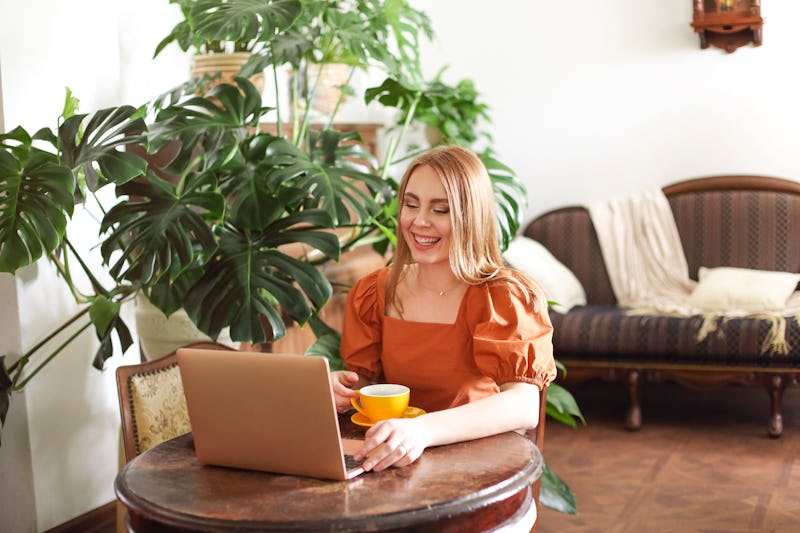 A woman sends emails. Here's your daily horoscope for February 9, 2022.