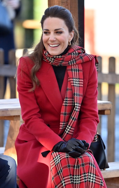 Kate Middleton in a tartan scarf and red coat to visit Cardiff Castle in 2020.