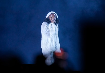 Kendrick Lamar performs on stage with Kendrick Lamar lyrics that are perfect as Instagram captions. 