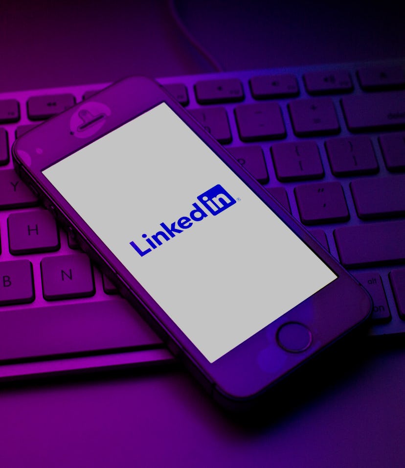 SPAIN - 2021/10/13: In this photo illustration a LinkedIn logo seen displayed on a smartphone on top...