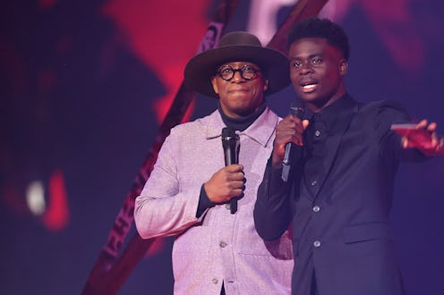 Ian Wright and Bukayo Saka present an award at The BRIT Awards 2022