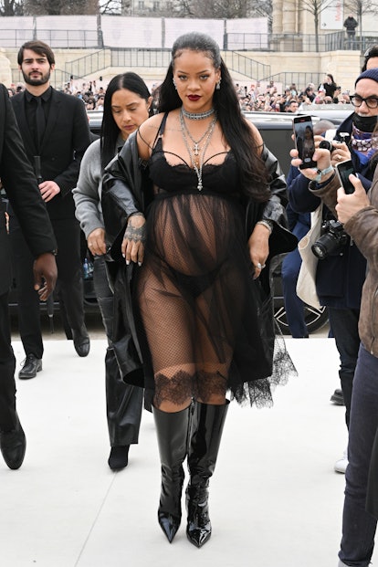 Rihanna wears a lingerie outfit to Dior runway show.