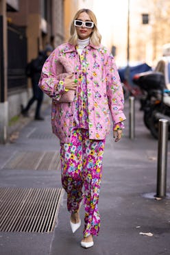 MILAN, ITALY - FEBRUARY 27: Candela Pelizza poses ahead of the MSGM fashion show wearing a pink flor...