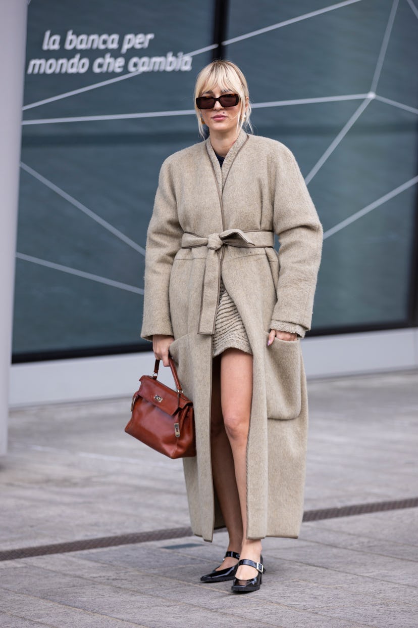 MILAN, ITALY - FEBRUARY 24: Eleonora Carisi poses ahead of the Max Mara fashion show wearing a creme...