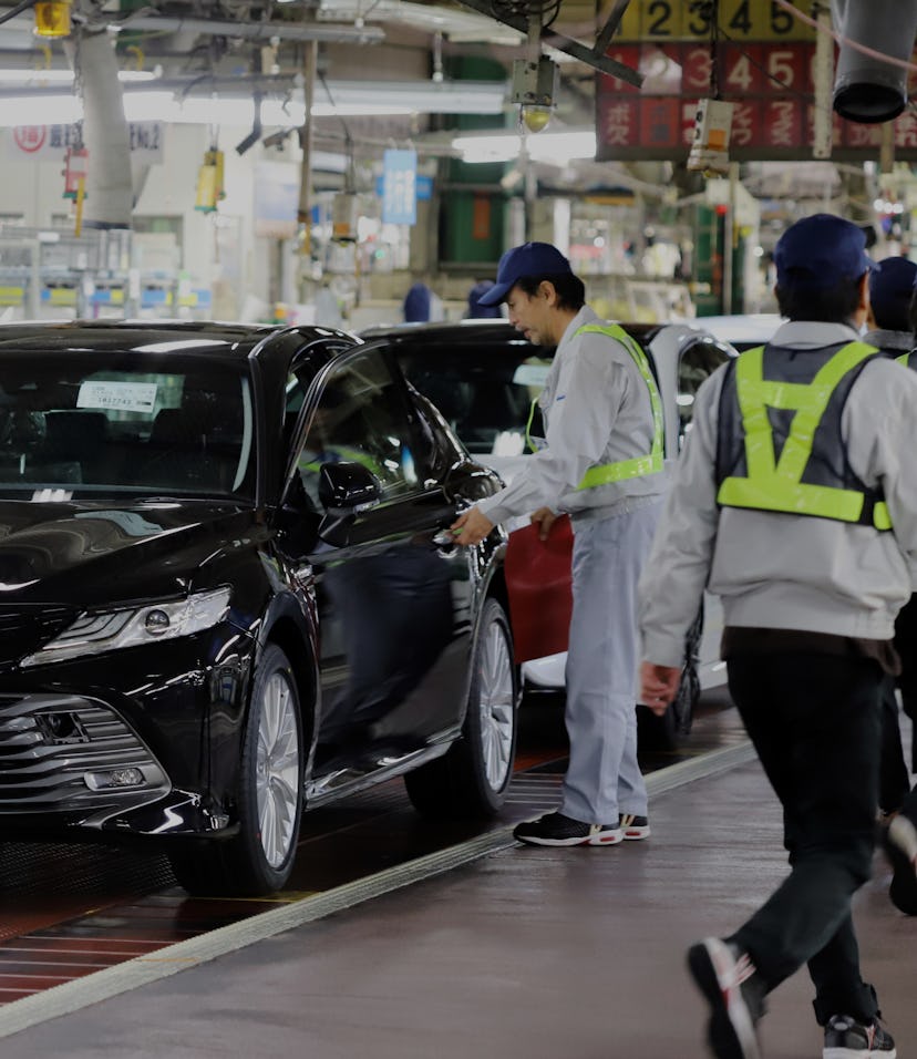 Japanese automobile giant Toyota Camry leaves an assemble line at the company's Tsutsumi Plant in To...