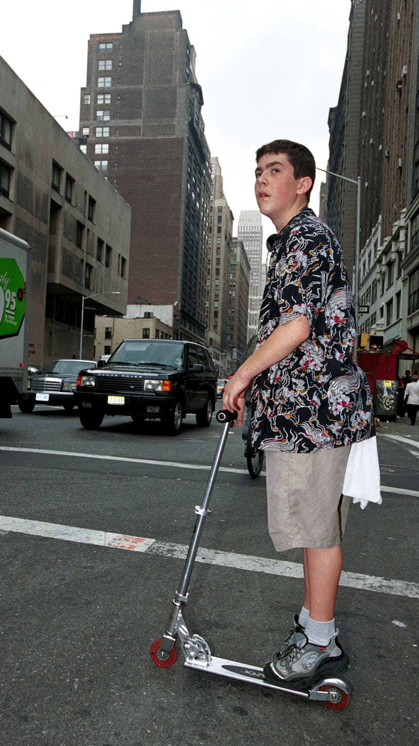 370397 03: Jake Smith, 16, of Queens rides his Razor Scooter June 1, 2000 in Manhattan, NY. The Razo...