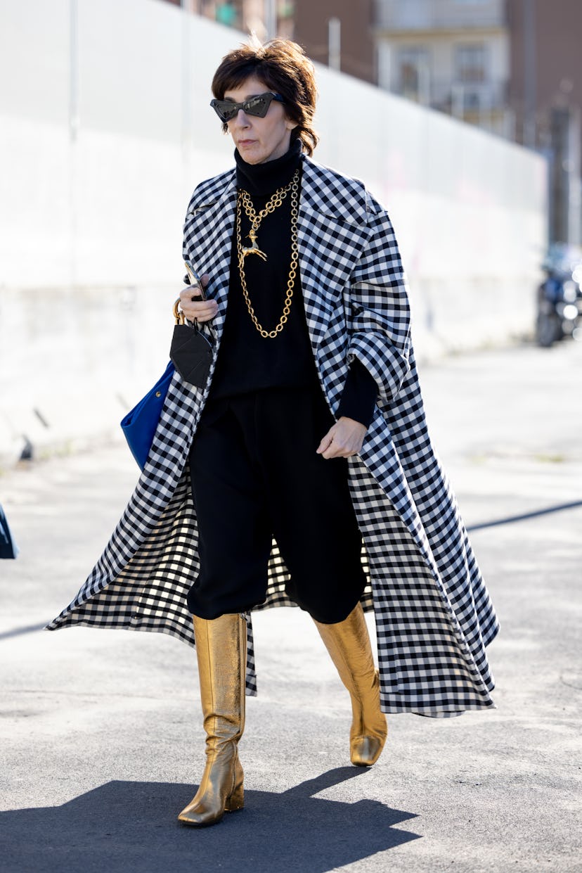 MILAN, ITALY - FEBRUARY 26: A guest poses ahead of the Marni fashion show during the Milan Fashion W...