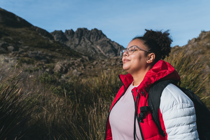 Backpacker taking a deep breath in the mountains of Itatiaia - Agulhas Negras