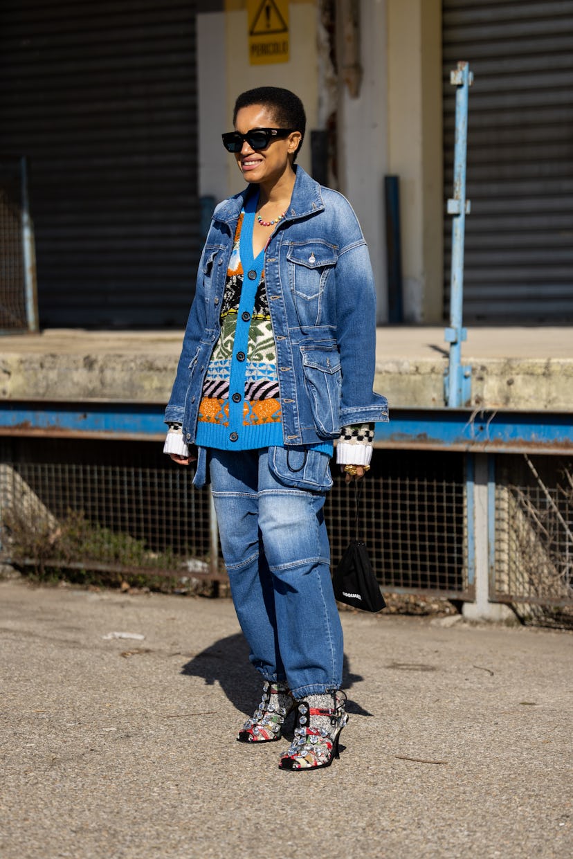 MILAN, ITALY - FEBRUARY 27: Tamu McPherson is seen ahead of the Dsquared2 fashion show wearing denim...