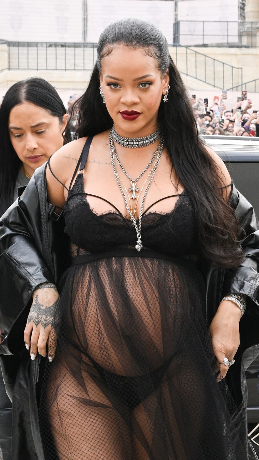 PARIS, FRANCE - MARCH 01: Rihanna attends the Dior Womenswear Fall/Winter 2022/2023 show as part of ...