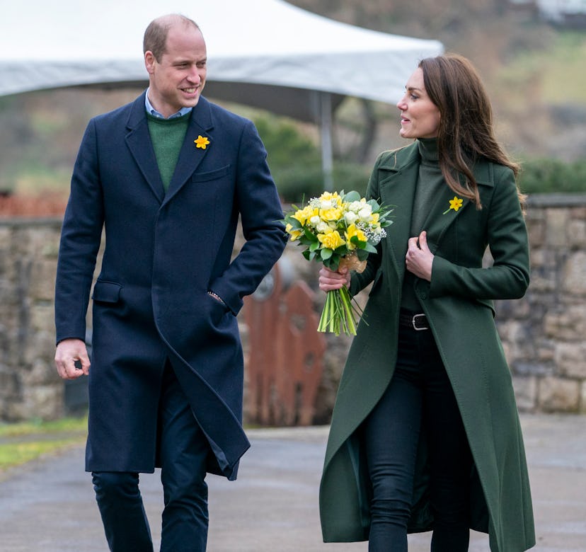 Kate Middleton and Prince William wearing tailored coats.