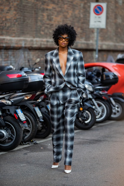 MILAN, ITALY - FEBRUARY 25: Didi Stone seen wearing grey checkered suit outside Sportmax fashion sho...