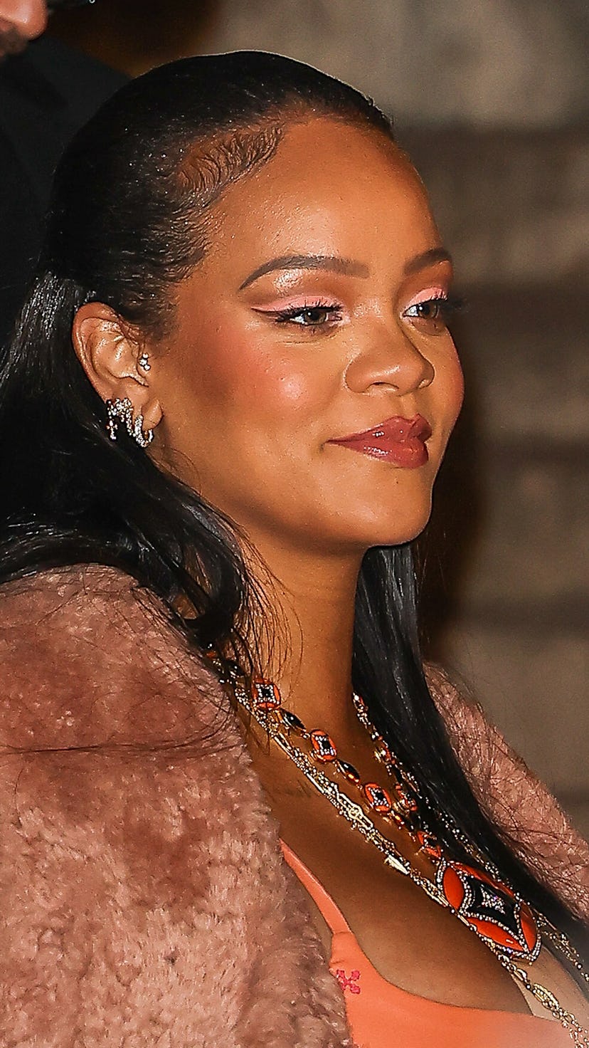 Rihanna wore peach eyeshadow at the Off-White Womenswear Fall/Winter 2022/2023 show as part of Paris...