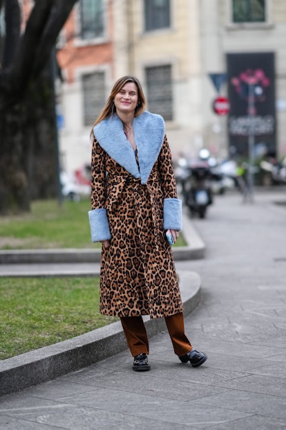 MILAN, ITALY - FEBRUARY 24: Eugenie Trochu wears a brown and beige leopard print pattern with pale b...