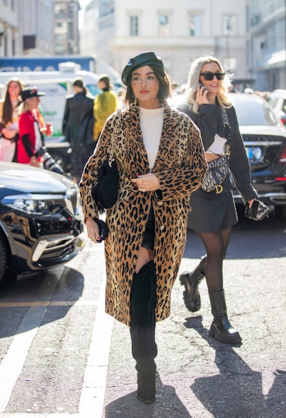 MILAN, ITALY - FEBRUARY 26: Taylor LaShae seen wearing coat with animal print, black beret, bag, ove...