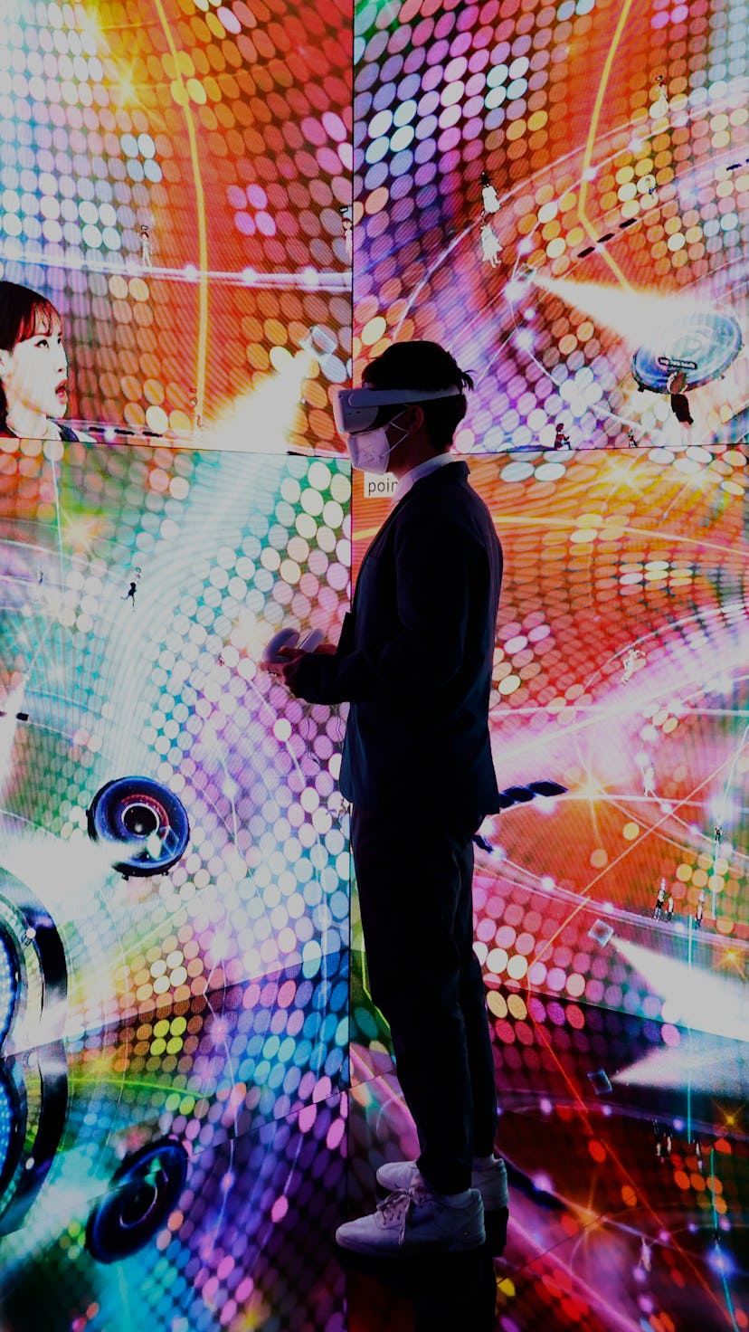 A congress attendant trying a VR experience with the Meta Oculus Quest 2 headset at the SK telecom s...