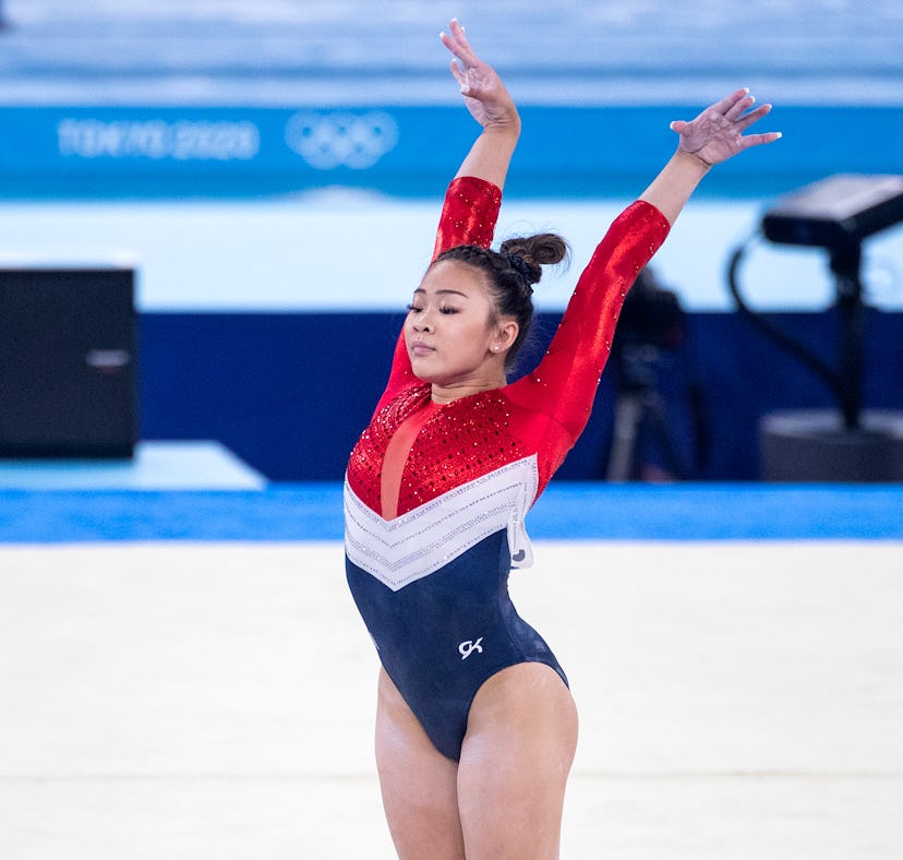 Suni Lee at the Olympics, ahead of her 19th birthday, where she wore an Olympic ring necklace.
