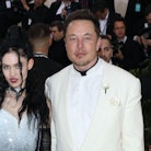 Grimes and Elon Musk at the Met Gala years ago - the couple welcomed a daughter via surrogate in Dec...