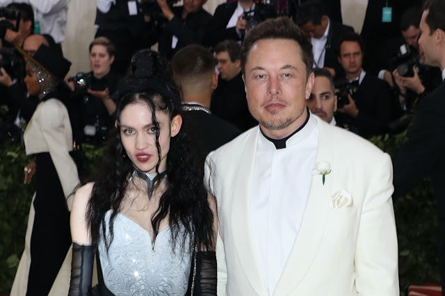 Grimes and Elon Musk at the Met Gala years ago - the couple welcomed a daughter via surrogate in Dec...