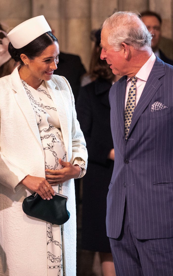 Britain's Meghan, Duchess of Sussex (L) talks with Britain's Prince Charles, Prince of Wales (R) as ...