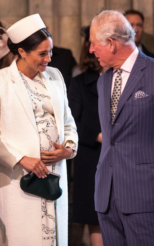 Britain's Meghan, Duchess of Sussex (L) talks with Britain's Prince Charles, Prince of Wales (R) as ...