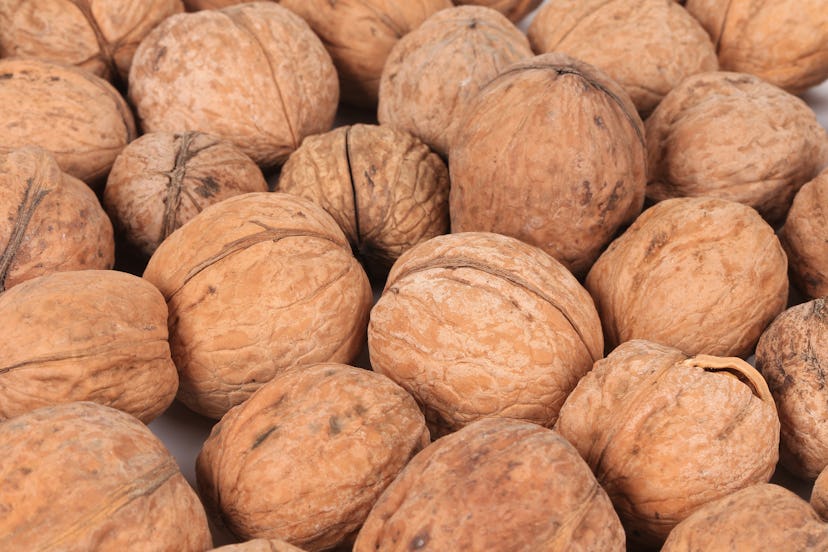 Close up of walnuts. Macro. Whole background.