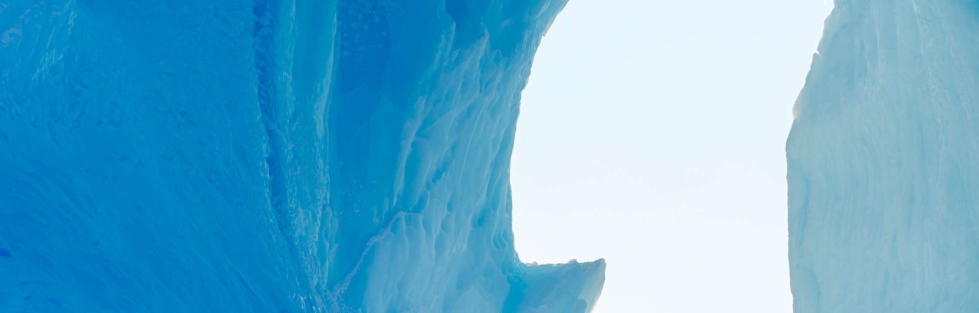 Iceberg frozen into the sea ice of the Uummannaq fjord system during winter in the the north west of...