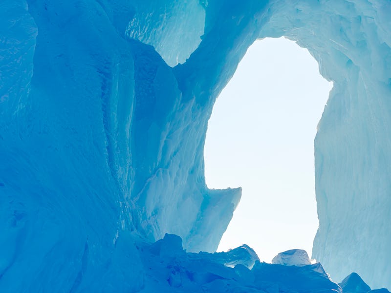 Iceberg frozen into the sea ice of the Uummannaq fjord system during winter in the the north west of...