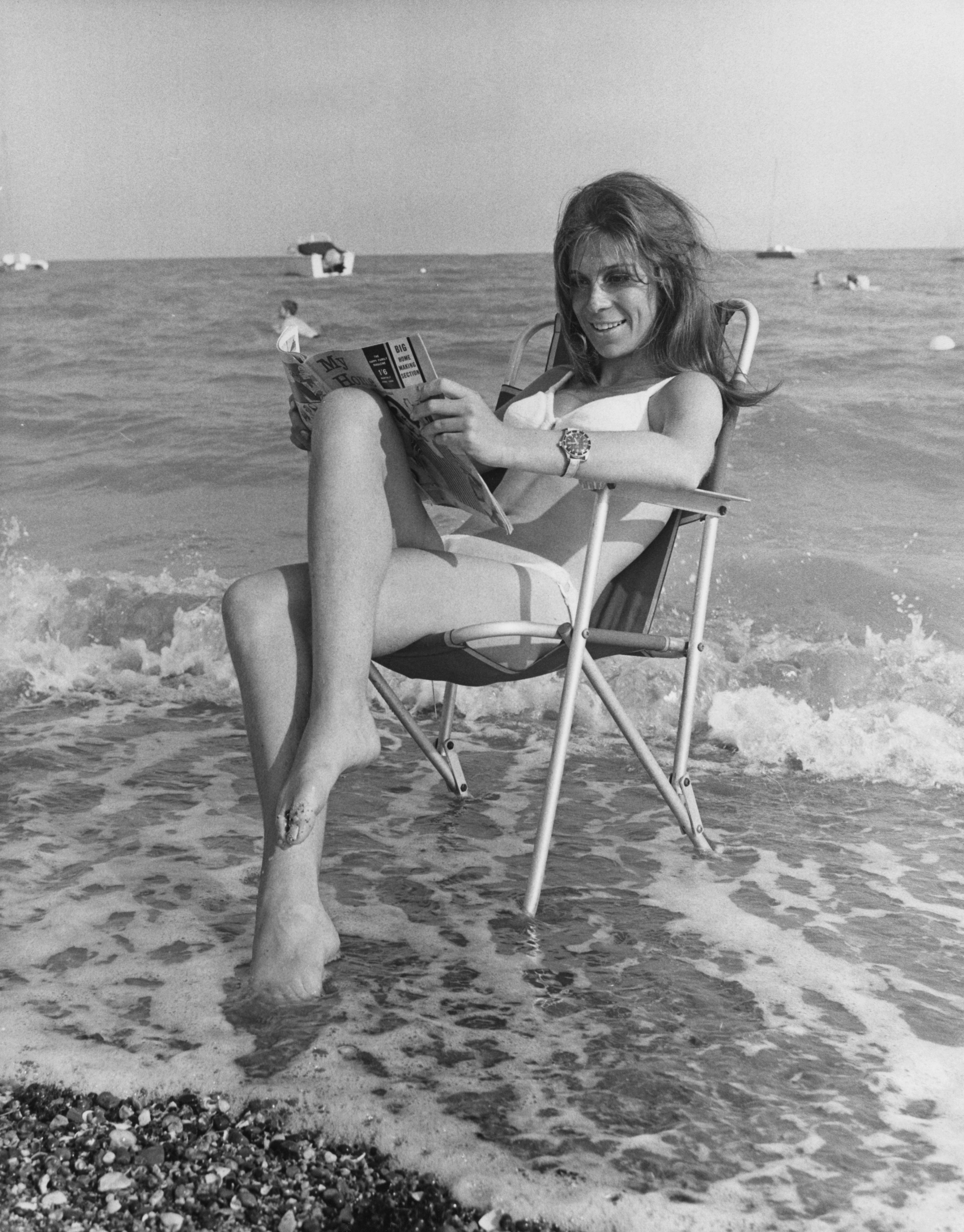 British actress Sandra Bryant, star of the television series 'Special Branch', relaxes on the beach,...
