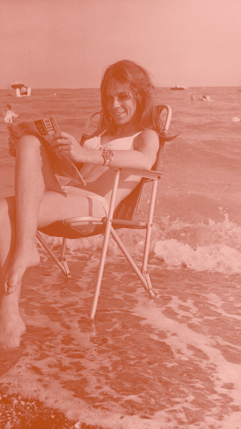 British actress Sandra Bryant, star of the television series 'Special Branch', relaxes on the beach,...
