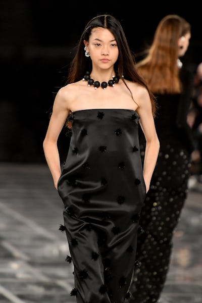 a model wearing a thick ball necklace on the Givenchy runway