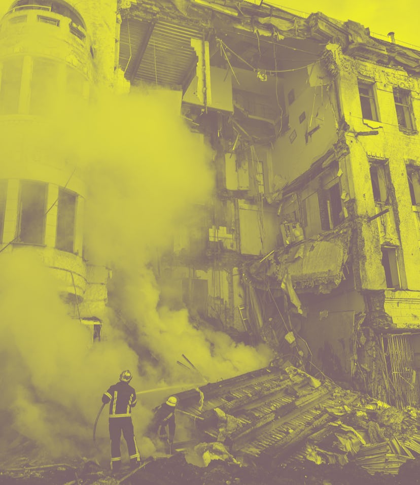 KHARKIV, UKRAINE - MARCH 14: Responders are seen at the scene after a building destroyed by a Russia...