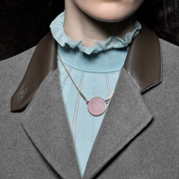 a model wearing an antique-inspired cameo necklace on the the Hermès runway