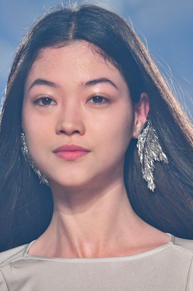 a model wearing silver fringe earrings on the Isabel Marant runway