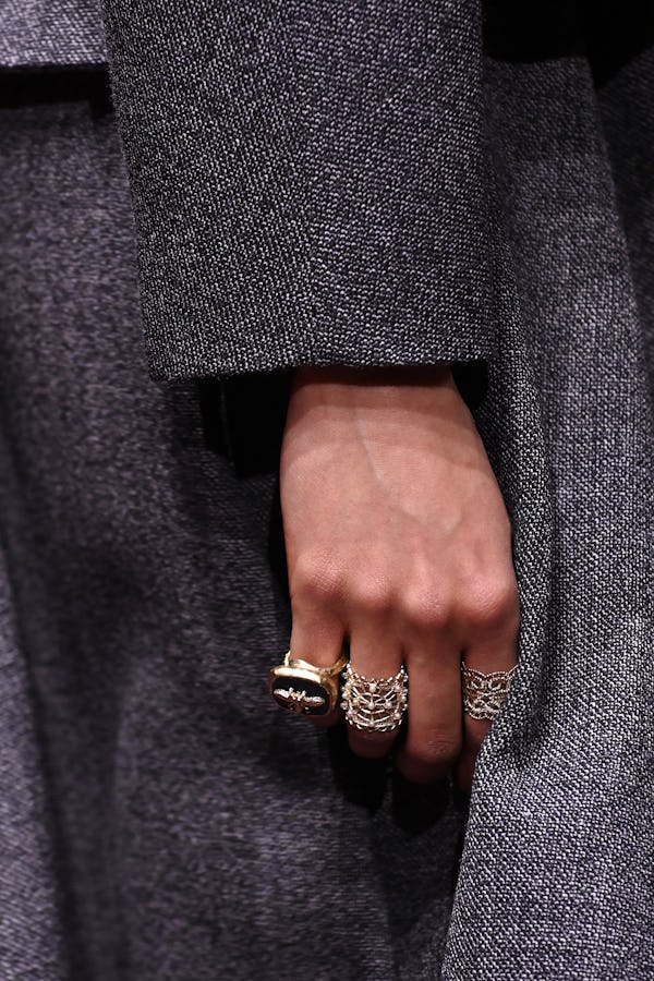 a model wearing antique-inspired rings on the Dior runway