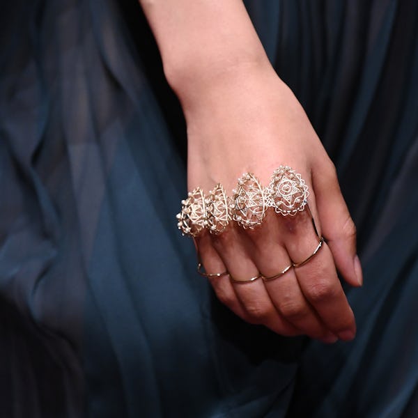 a model wearing a multi-finger ring on the Dior runway