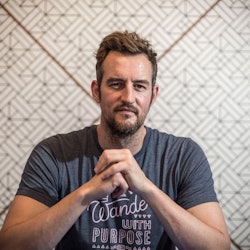 Miguel McKelvey, co-founder and chief creative officer of WeWork Inc., reacts during an interview on...