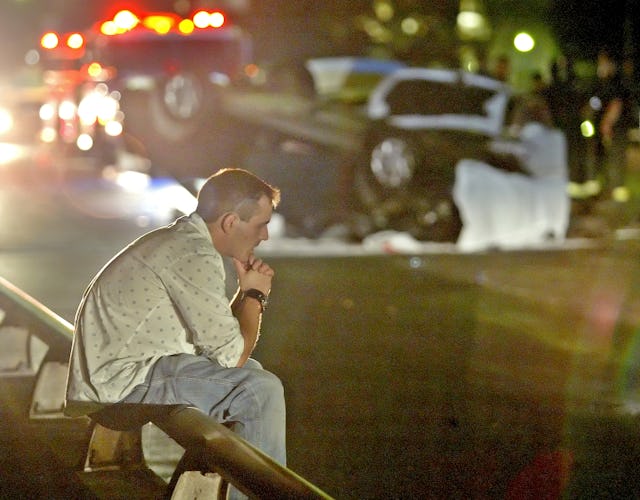 (8/11/05-Cambridge, MA) Fatal car accident on the Mass Ave Bridge. A man wanted for questioning sits...