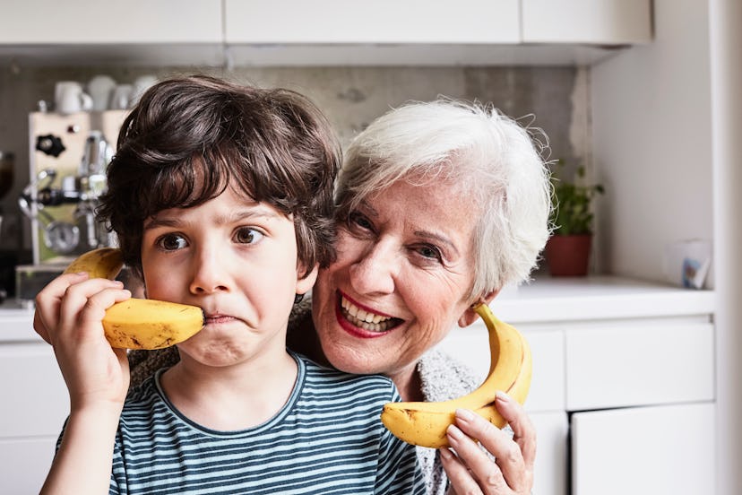 boy and grandma pretending bananas are phones in a list of April Fools' pranks for grandparents