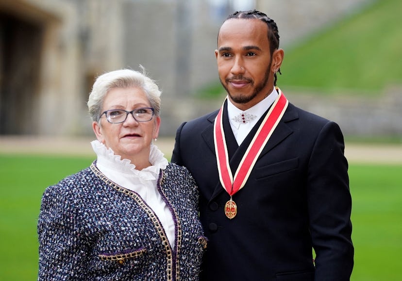 TOPSHOT - Mercedes' British driver Lewis Hamilton stands with his with his mother Carmen Lockhart, a...